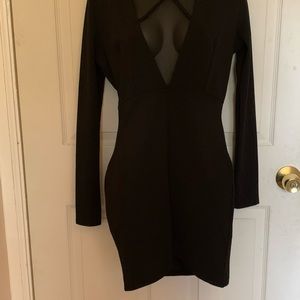 *Never Worn* Black dress. Long sleeve, low cut front